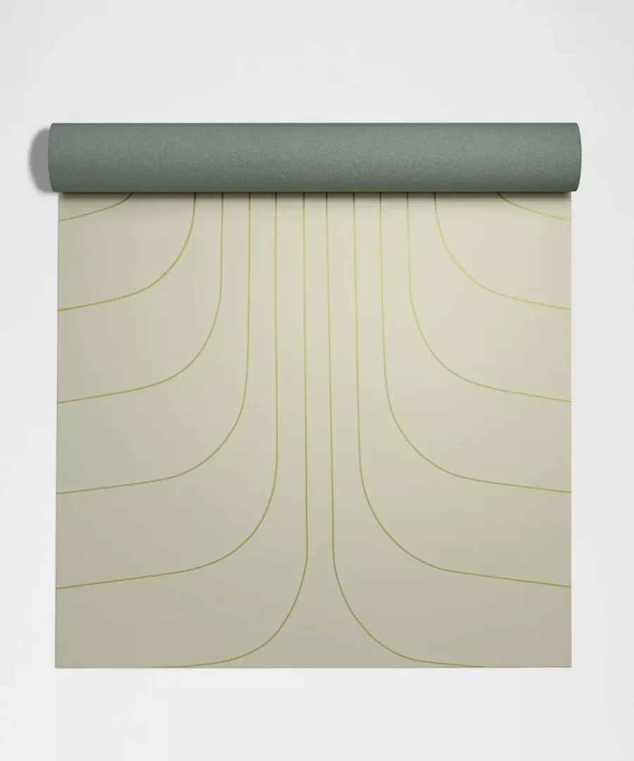 lululemon Align mat unrolling flat, top view of the printed alignment lines