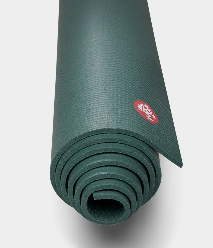 Manduka PRO mat rolled, seen end-on: the tight coil of 6 mm PVC layers